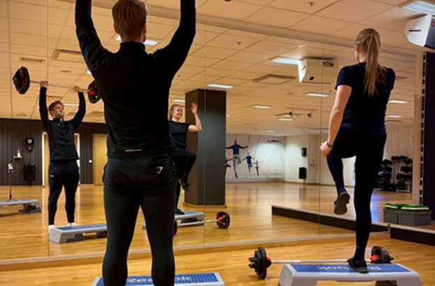 people exercising in a gym