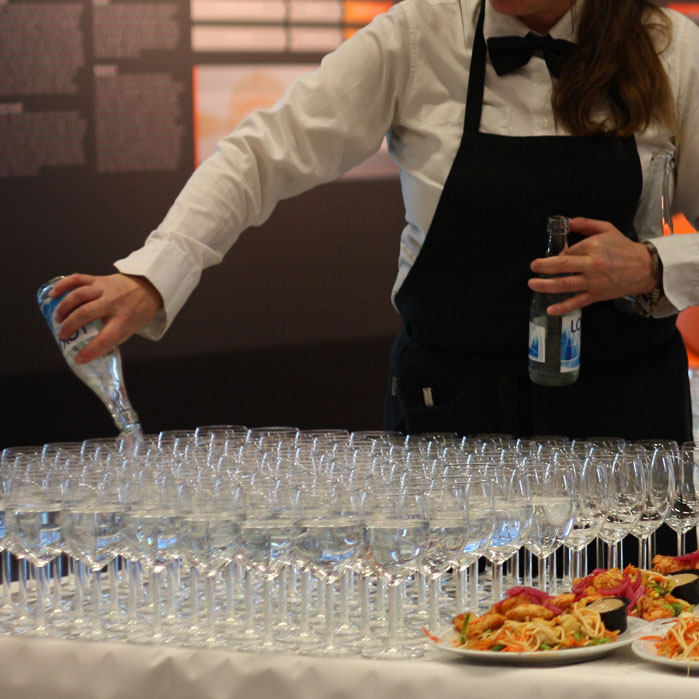 person pouring drinks